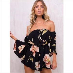 Black floral romper. Never worn